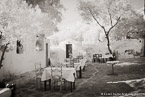 Cafe , Mykonos Greece #YNL-010.  Infrared Photograph,  Stretched and Gallery Wrapped, Limited Edition Archival Print on Canvas:  60 x 40 inches, $1590.  Custom Proportions and Sizes are Available.  For more information or to order please visit our ABOUT page or call us at 561-691-1110.