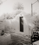 Cafe , Mykonos Greece #YNL-544.  Infrared Photograph,  Stretched and Gallery Wrapped, Limited Edition Archival Print on Canvas:  40 x 48 inches, $1560.  Custom Proportions and Sizes are Available.  For more information or to order please visit our ABOUT page or call us at 561-691-1110.