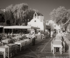 Cafe , Mykonos Greece #YNL-556.  Black-White Photograph,  Stretched and Gallery Wrapped, Limited Edition Archival Print on Canvas:  48 x 40 inches, $1560.  Custom Proportions and Sizes are Available.  For more information or to order please visit our ABOUT page or call us at 561-691-1110.