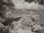 Tropical Lake, Costa Rica #YNS-913.  Infrared Photograph,  Stretched and Gallery Wrapped, Limited Edition Archival Print on Canvas:  56 x 40 inches, $1590.  Custom Proportions and Sizes are Available.  For more information or to order please visit our ABOUT page or call us at 561-691-1110.
